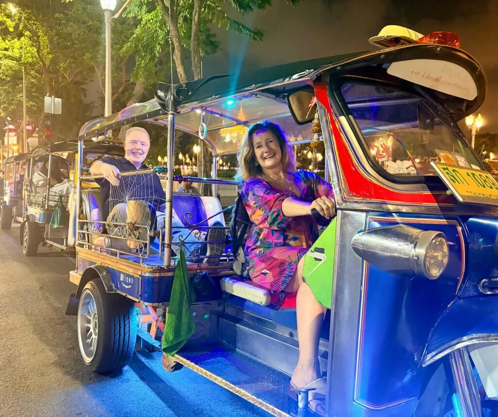 Is it safe to take a tuk-tuk at night in Bangkok, and what are the comments of tourists about tuk-tuks